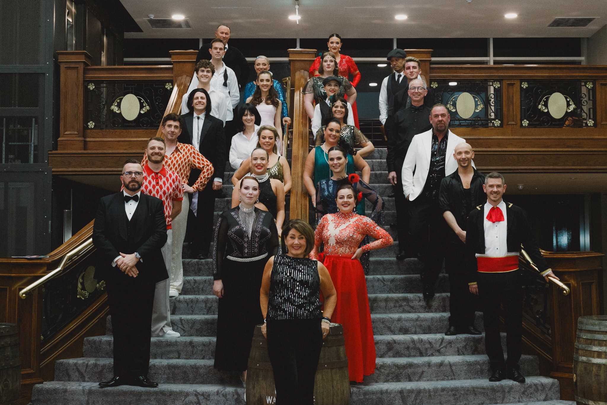 A group of dancers standing on stairs